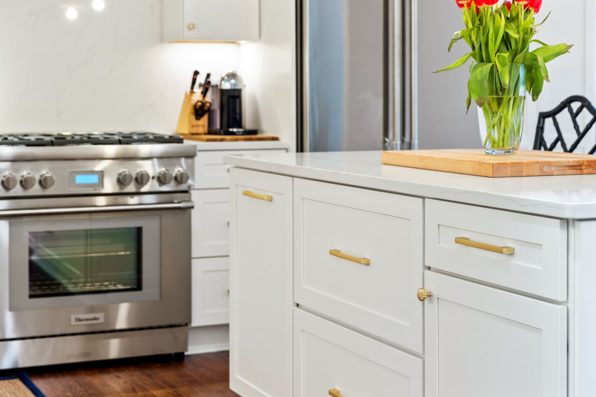 Kitchen cabinet detail with brass pulls
