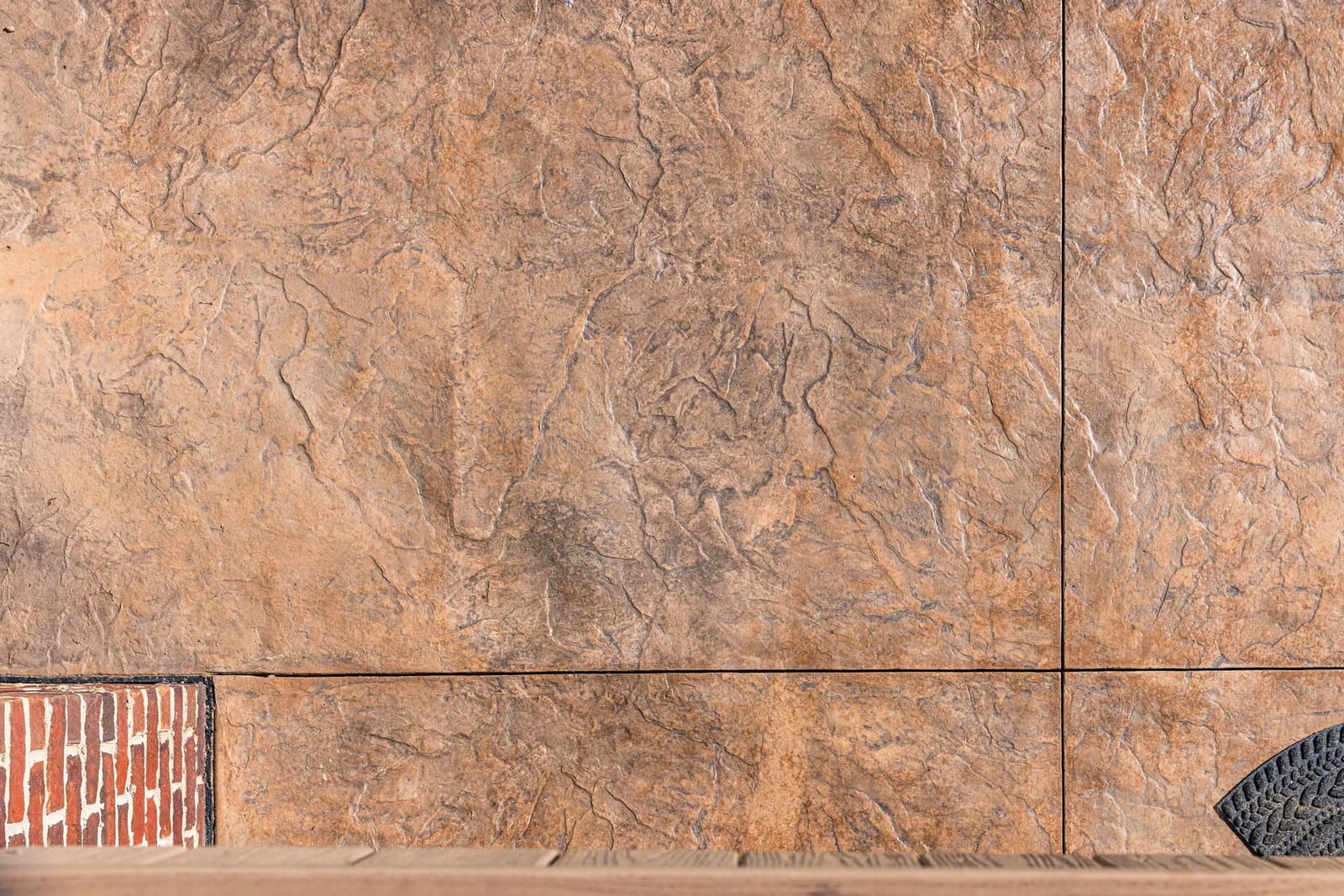 Stamped concrete patio with brick border