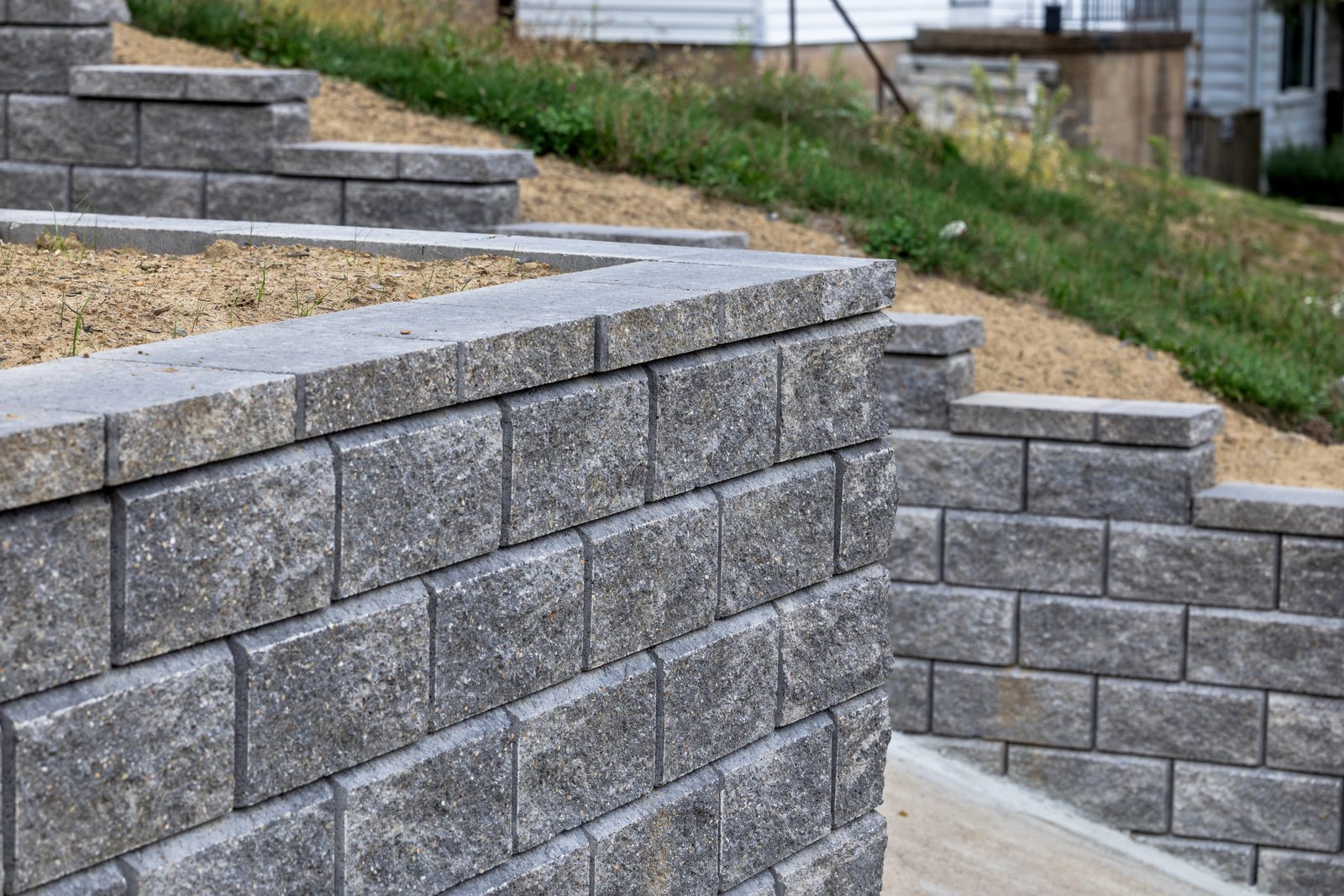 Tiered block retaining wall hillside